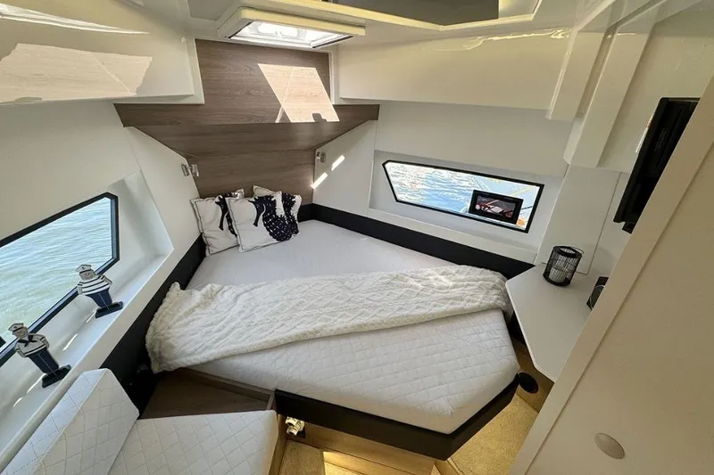 Slide: The Image of Luxurious interior of 2026 Cobra Yachts Campione 41 Coupe with cozy bed and modern decor. - 13