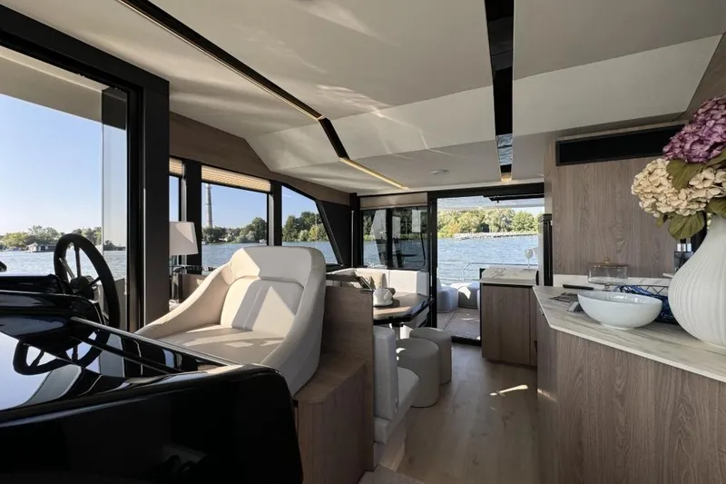 Slide: The Image of Luxurious interior of 2026 Cobra Yachts Campione 41 Coupe with elegant seating and scenic views. - 6