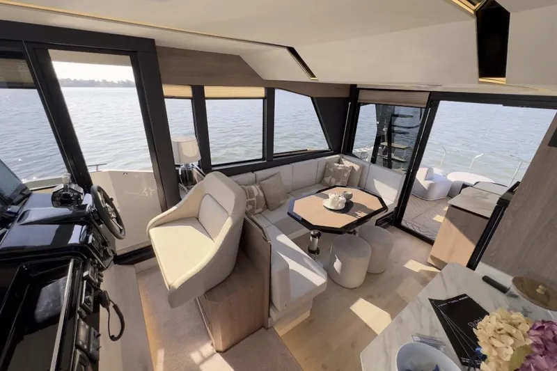 Slide: The Image of Luxurious interior of 2026 Cobra Yachts Campione 41 Coupe with elegant seating and panoramic windows. - 7