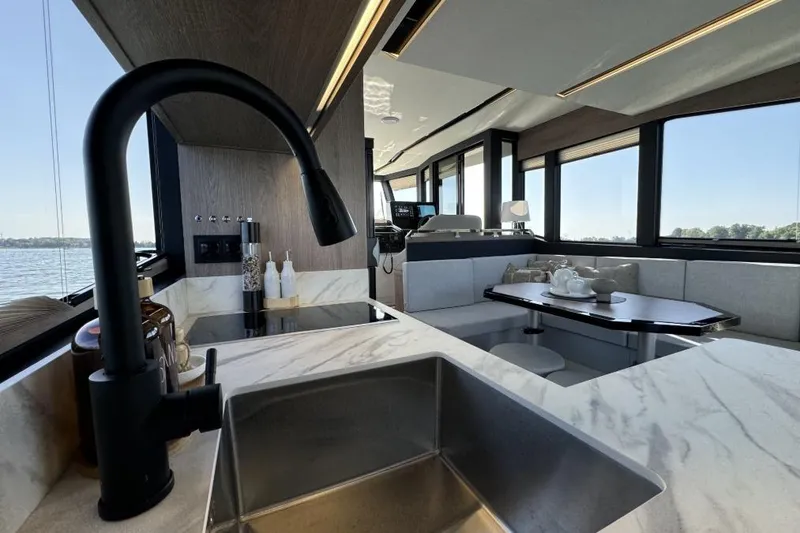Slide: The Image of Luxurious interior of 2026 Cobra Yachts Campione 41 Coupe with modern kitchen and seating area. - 8