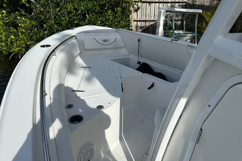 Slide: The Image of 2018 Sea Hunt Ultra 234 boat interior with seating and storage compartments. - 17
