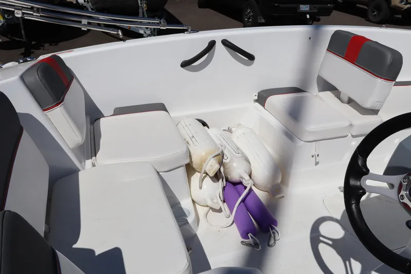 Slide: The Image of Interior of 2023 White River Tahoe boat with white seating and fenders. - 12
