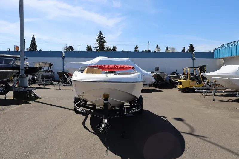 Slide: The Image of 2023 White River Tahoe boat on trailer in outdoor dealership lot. - 3
