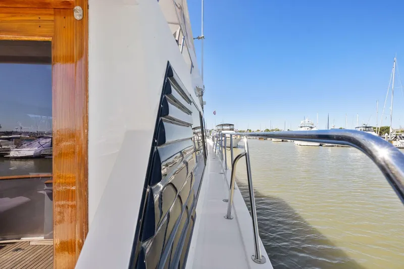 Slide: The Image of Side view of 1991 Ocean Alexander 520 Pilothouse yacht docked at marina. - 10