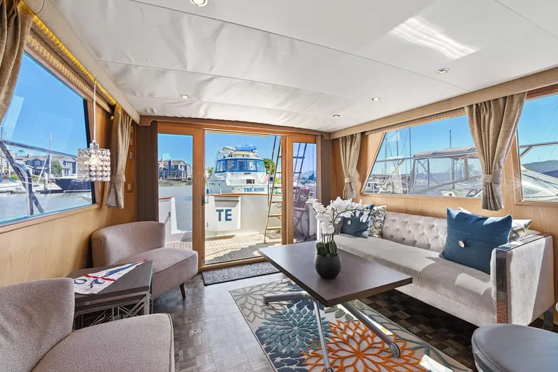 Slide: The Image of Luxurious interior of 1991 Ocean Alexander 520 Pilothouse yacht with elegant seating and decor. - 14
