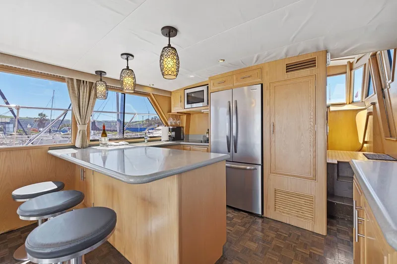 Slide: The Image of Luxurious kitchen interior of 1991 Ocean Alexander 520 Pilothouse yacht with modern amenities. - 15