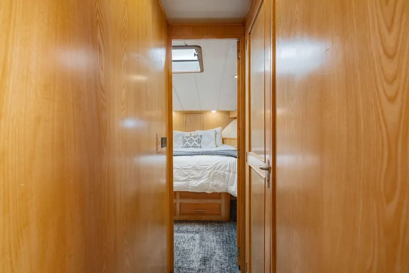Slide: The Image of Interior hallway view of 1991 Ocean Alexander 520 Pilothouse, leading to a cozy bedroom. - 27