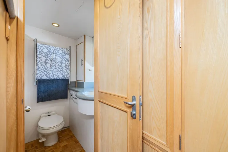Slide: The Image of Bathroom interior of 1991 Ocean Alexander 520 Pilothouse yacht with wooden cabinetry. - 29