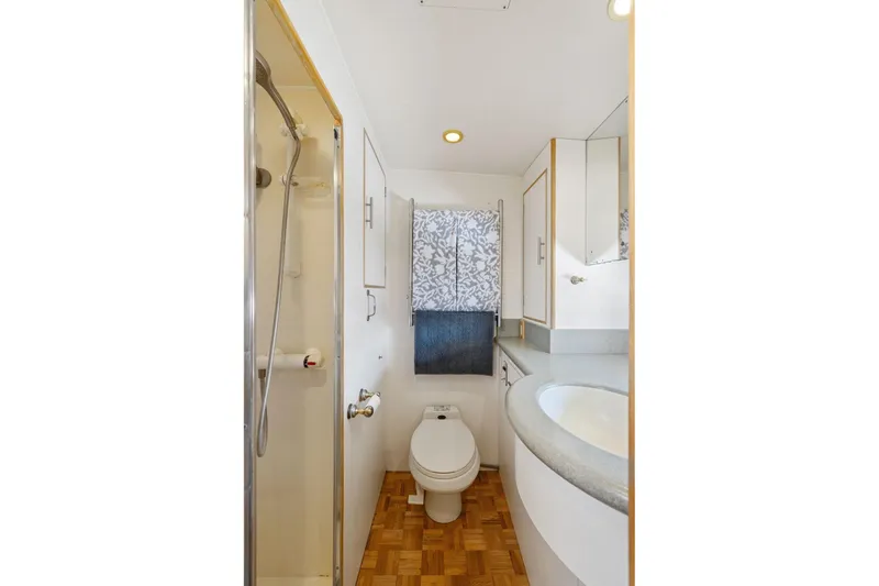 Slide: The Image of Bathroom interior of 1991 Ocean Alexander 520 Pilothouse yacht, featuring shower and toilet. - 31
