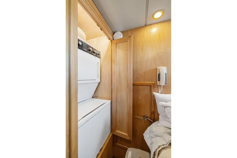 Slide: The Image of Laundry area in 1991 Ocean Alexander 520 Pilothouse yacht with stacked washer and dryer. - 33