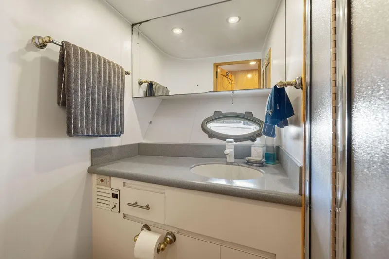 Slide: The Image of Bathroom interior of 1991 Ocean Alexander 520 Pilothouse yacht, featuring sink and mirror. - 34