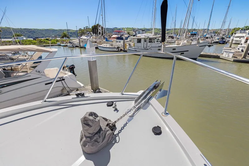 Slide: The Image of Bow view of 1991 Ocean Alexander 520 Pilothouse docked in a marina. - 38