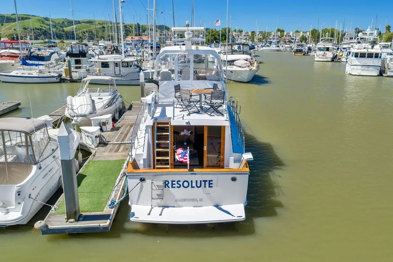Slide: The Image of Ocean Alexander 520 Pilothouse yacht docked in a marina, 1991 model. - 5