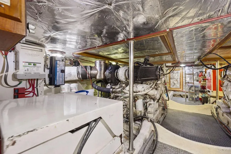 Slide: The Image of Engine room of 1991 Ocean Alexander 520 Pilothouse yacht, showcasing machinery and equipment. - 50