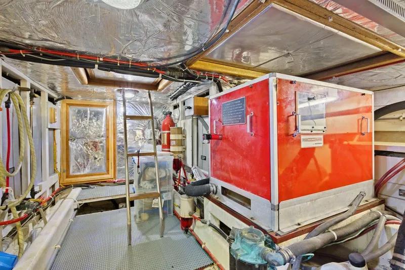 Slide: The Image of Engine room of 1991 Ocean Alexander 520 Pilothouse with equipment and ladder. - 53
