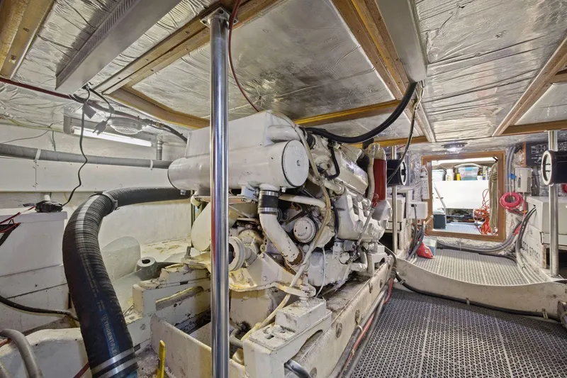 Slide: The Image of Engine room of 1991 Ocean Alexander 520 Pilothouse yacht, showcasing machinery and equipment. - 56