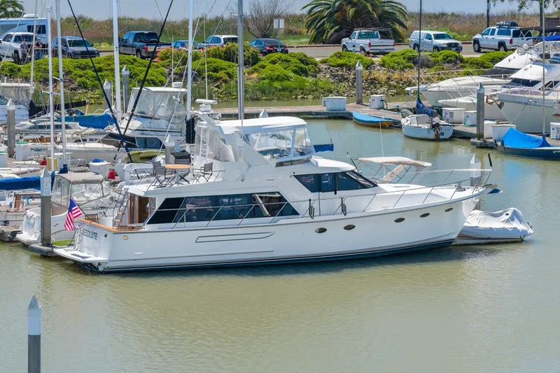 Slide: The Image of 1991 Ocean Alexander 520 Pilothouse yacht docked in a marina. - 6
