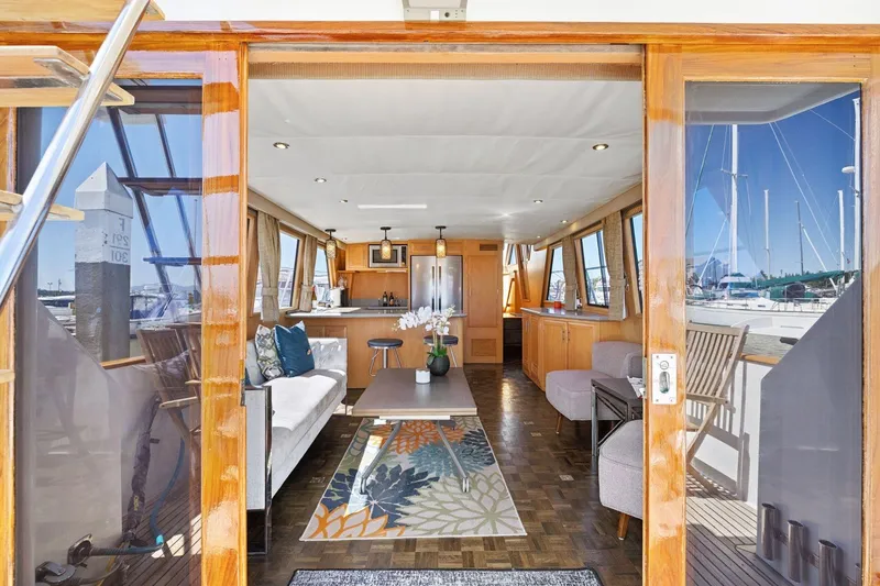 Slide: The Image of Interior of 1991 Ocean Alexander 520 Pilothouse yacht, featuring elegant seating and decor. - 8
