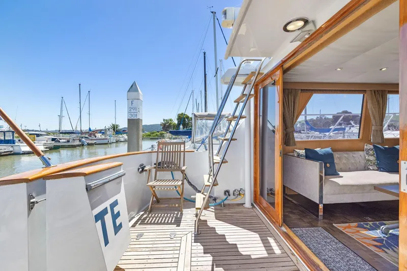 Slide: The Image of 1991 Ocean Alexander 520 Pilothouse yacht interior and deck with marina view. - 9