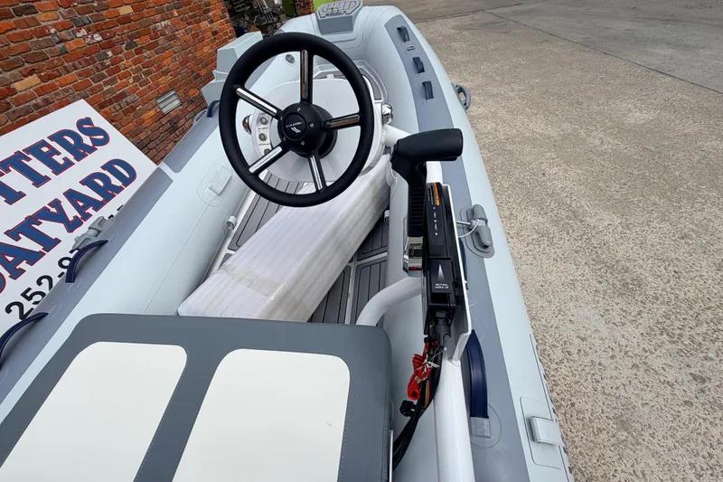 Slide: The Image of 2023 Highfield Classic 380 FCT boat interior with steering wheel and controls. - 11