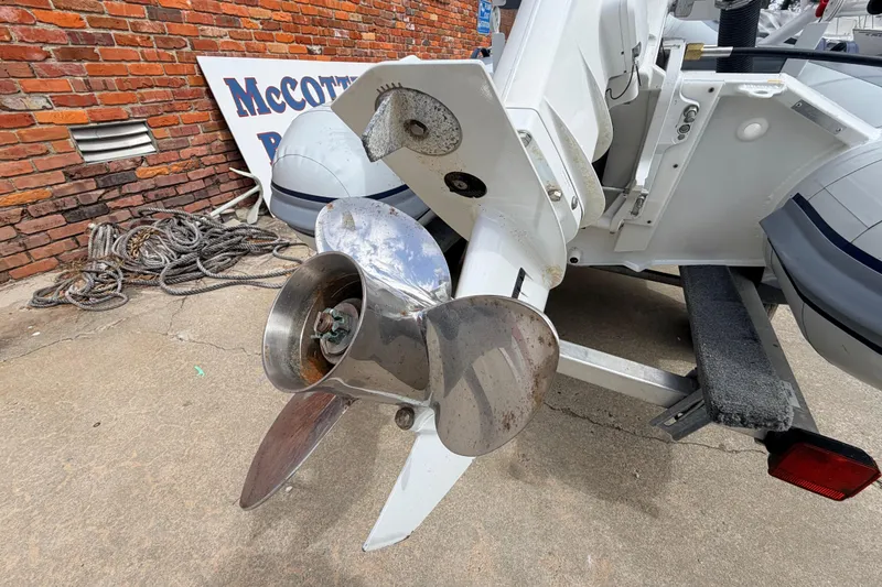 Slide: The Image of Outboard motor propeller of 2023 Highfield Classic 380 FCT boat on trailer. - 13