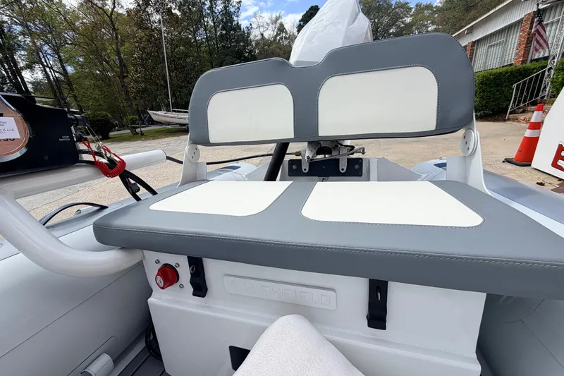Slide: The Image of 2023 Highfield Classic 380 FCT boat interior with gray and white seating, outdoors. - 17