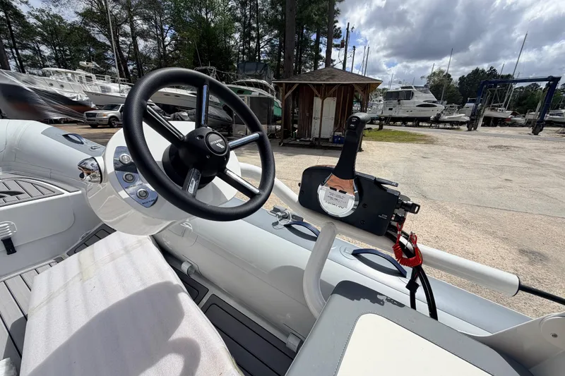 Slide: The Image of 2023 Highfield Classic 380 FCT boat interior with steering wheel and controls. - 20