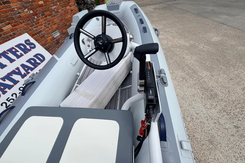 Slide: The Image of 2023 Highfield Classic 380 FCT boat interior with steering wheel and controls. - 24