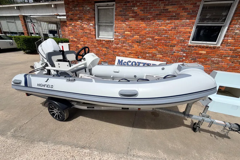 Slide: The Image of 2023 Highfield Classic 380 FCT inflatable boat on trailer, parked outside brick building. - 27