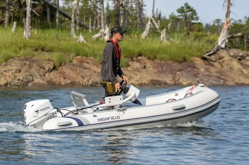 Slide: The Image of Manufacturer Provided Image: 2023 Highfield Classic 380 FCT boat cruising on a lake with a man steering. - 29
