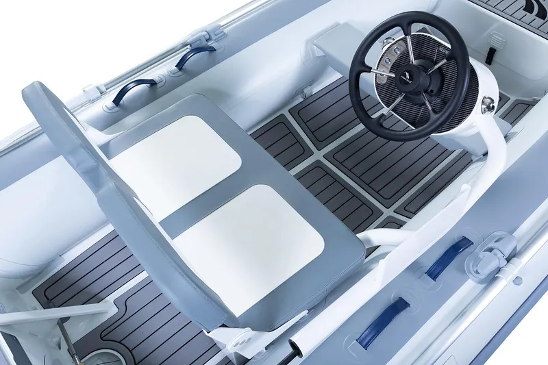 Slide: The Image of Manufacturer Provided Image: 2023 Highfield Classic 380 FCT boat interior with steering wheel and seating. - 34