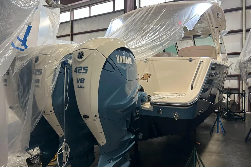 Slide: The Image of 2020 Grady-White Freedom 375 boat with twin Yamaha 425 V8 engines in a storage facility. - 10