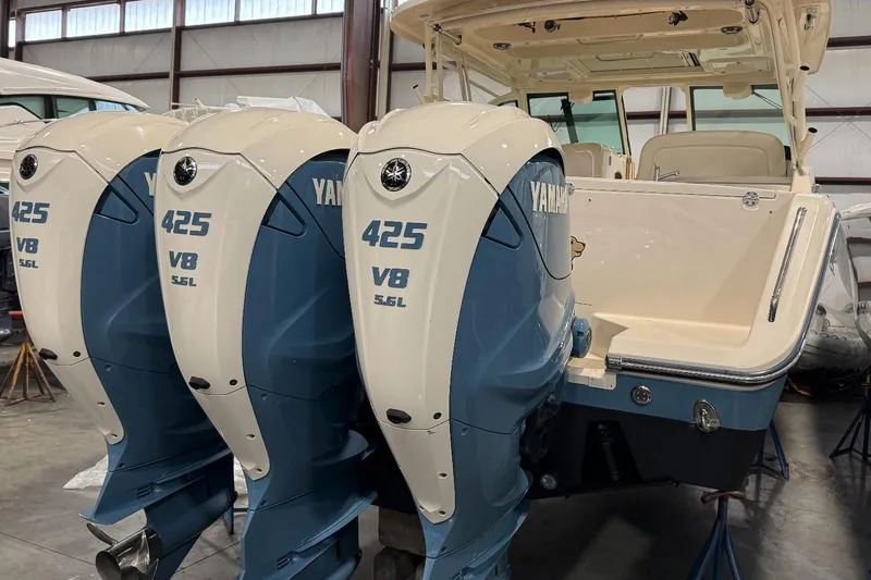 Slide: The Image of 2020 Grady-White Freedom 375 boat with triple Yamaha 425 V8 engines in a warehouse. - 11