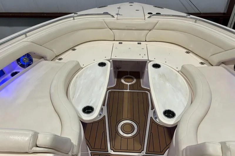 Slide: The Image of 2020 Grady-White Freedom 375 boat interior with cushioned seating and wood flooring. - 13