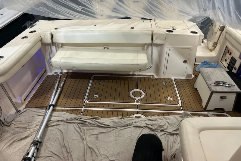 Slide: The Image of 2020 Grady-White Freedom 375 boat interior with teak flooring and white seating. - 14