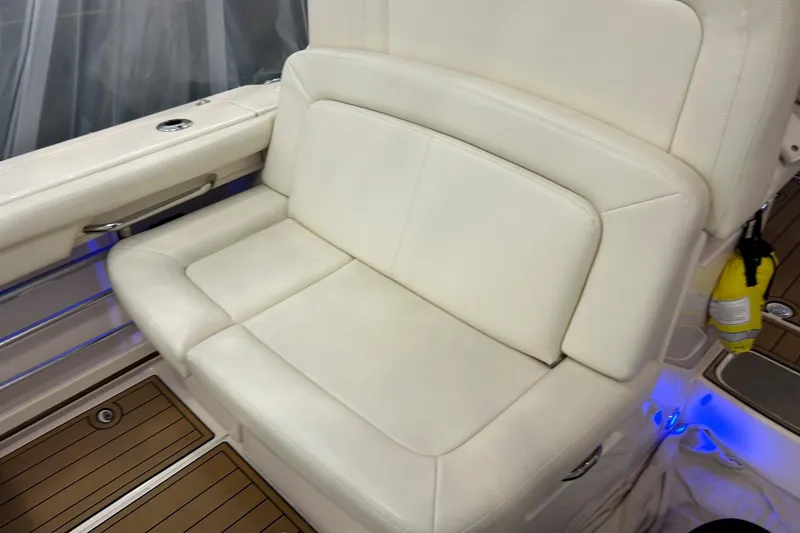 Slide: The Image of Luxurious seating on 2020 Grady-White Freedom 375 boat with elegant white upholstery. - 16