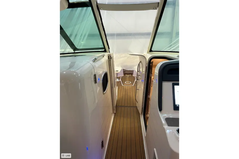 Slide: The Image of 2020 Grady-White Freedom 375 boat interior with teak flooring and modern design. - 18