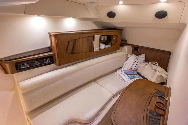 Slide: The Image of Manufacturer Provided Image: 2020 Grady-White Freedom 375 cabin interior with seating and wooden cabinetry. - 20