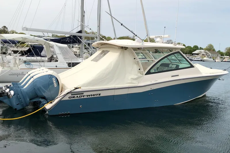 Slide: The Image of 2020 Grady-White Freedom 375 boat docked with Yamaha engines, featuring a sleek design. - 3