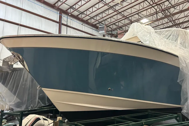 Slide: The Image of 2020 Grady-White Freedom 375 boat in storage, covered with protective plastic. - 5