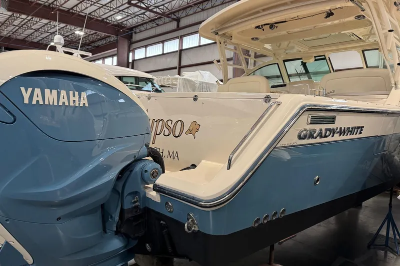 Slide: The Image of 2020 Grady-White Freedom 375 boat with Yamaha engine in a warehouse setting. - 6