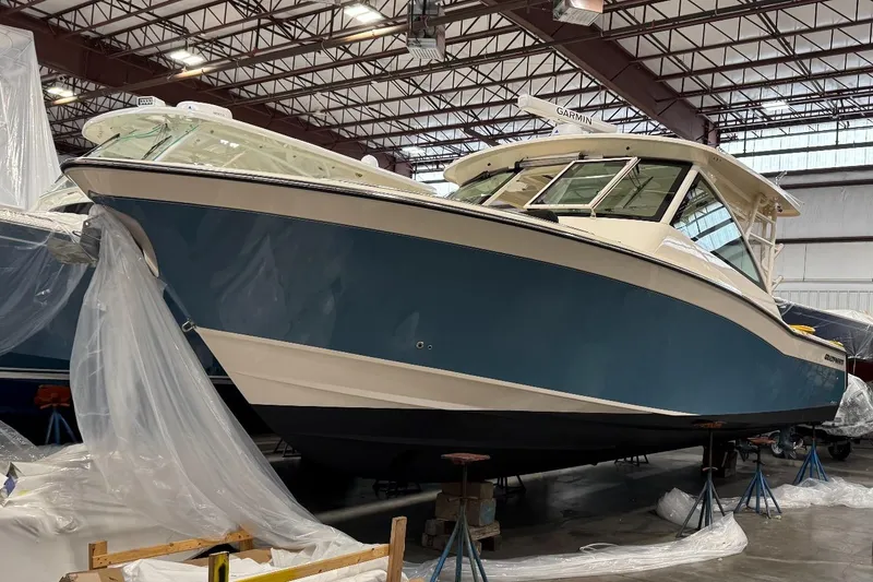 Slide: The Image of 2020 Grady-White Freedom 375 boat in storage, covered with protective plastic. - 8
