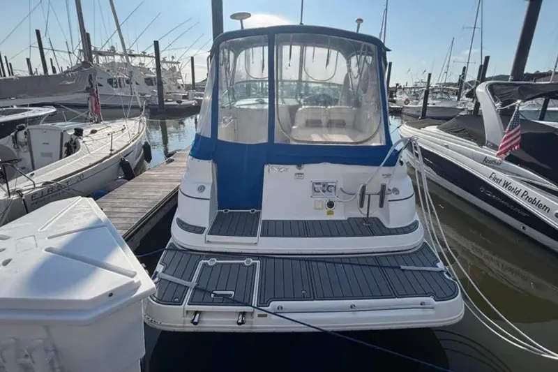 Slide: The Image of 2005 Cruisers Yachts 280 CXi Express docked at marina, rear view. - 4
