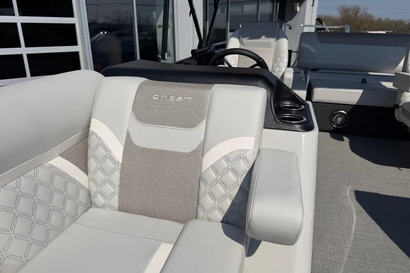 Slide: The Image of 2026 Crest Conquest 250 SLSC boat interior with luxurious seating and modern design. - 16