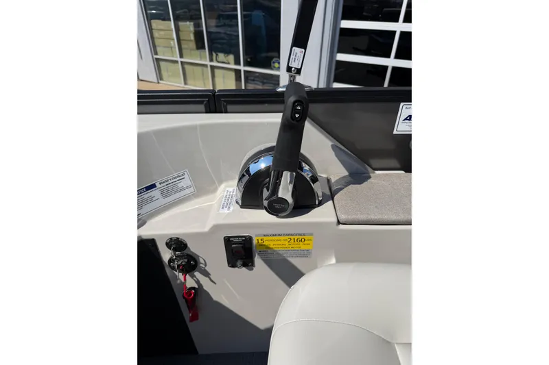 Slide: The Image of Control panel of 2026 Crest Conquest 250 SLSC boat with throttle and safety features. - 25