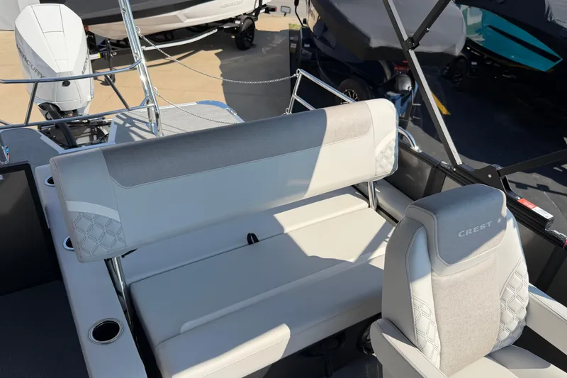 Slide: The Image of 2026 Crest Conquest 250 SLSC boat interior with luxurious seating and modern design. - 26