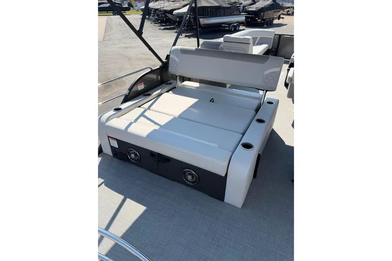 Slide: The Image of 2026 Crest Conquest 250 SLSC boat interior with cushioned seating and cup holders. - 28