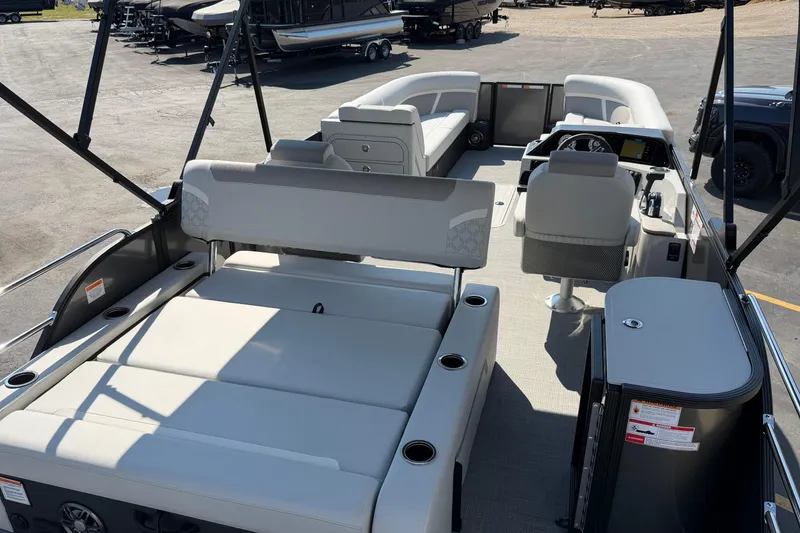 Slide: The Image of 2026 Crest Conquest 250 SLSC pontoon boat interior with spacious seating and modern design. - 29