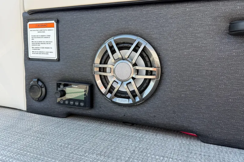 Slide: The Image of 2026 Crest Conquest 250 SLSC boat audio system with speaker and control panel. - 30