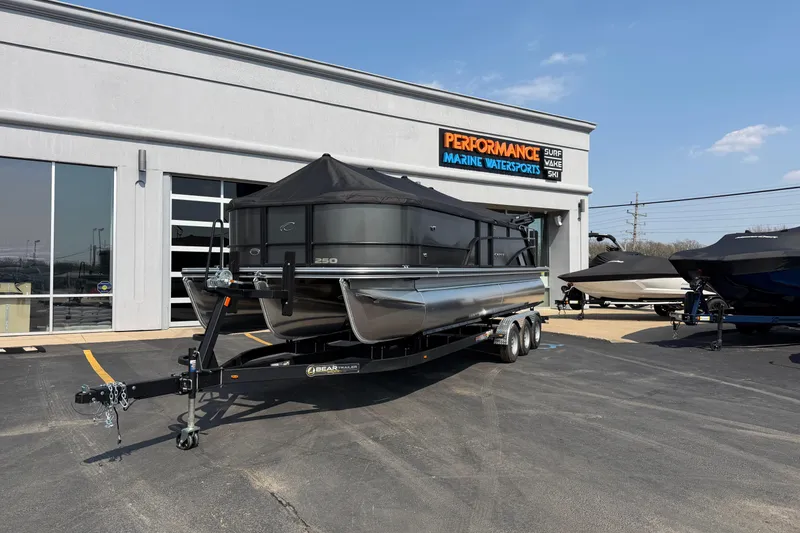 Slide: The Image of 2026 Crest Conquest 250 SLSC pontoon boat on trailer at marine dealership. - 33